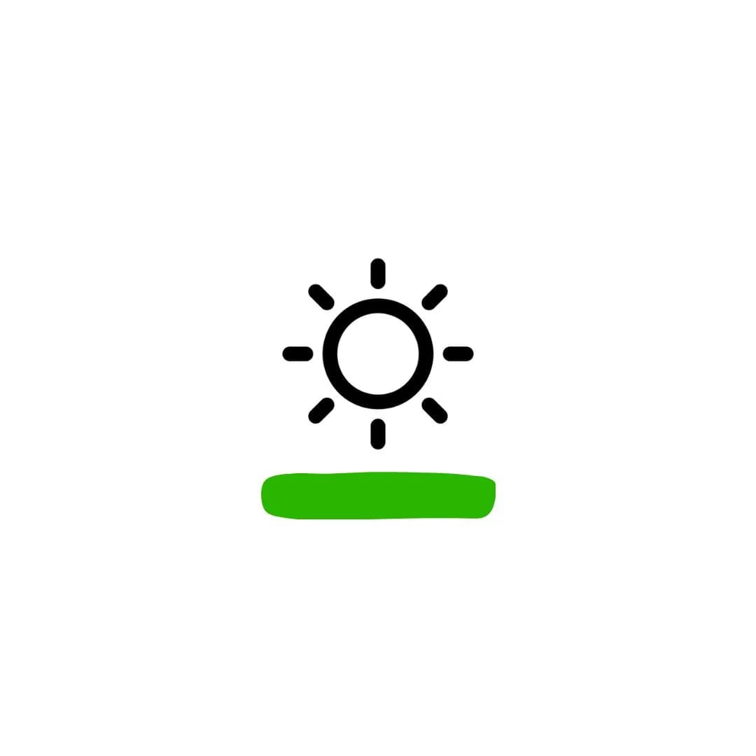 Sun rising above a green lawn